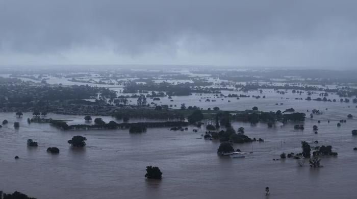 Death toll in Australia floods rises to four, tens of thousands stranded