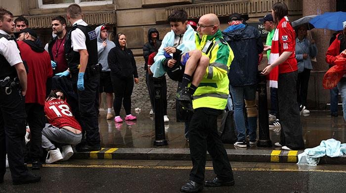 Several hurt as car crashes into fans during Liverpool FC parade