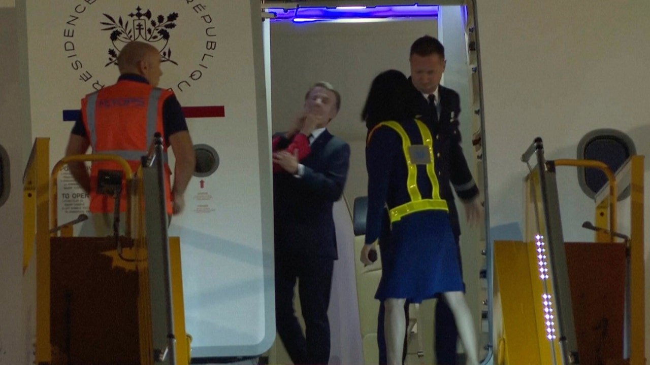 France's Macron shoved in face by wife, Brigitte, during Hanoi, Vietnam arrival