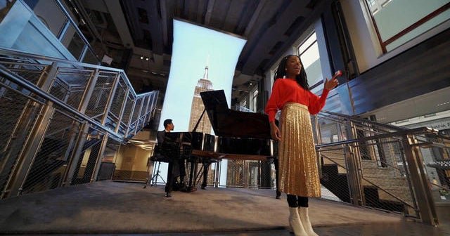 Jon Batiste and youth poet laureate Amanda Gorman pay tribute to Empire State Building
