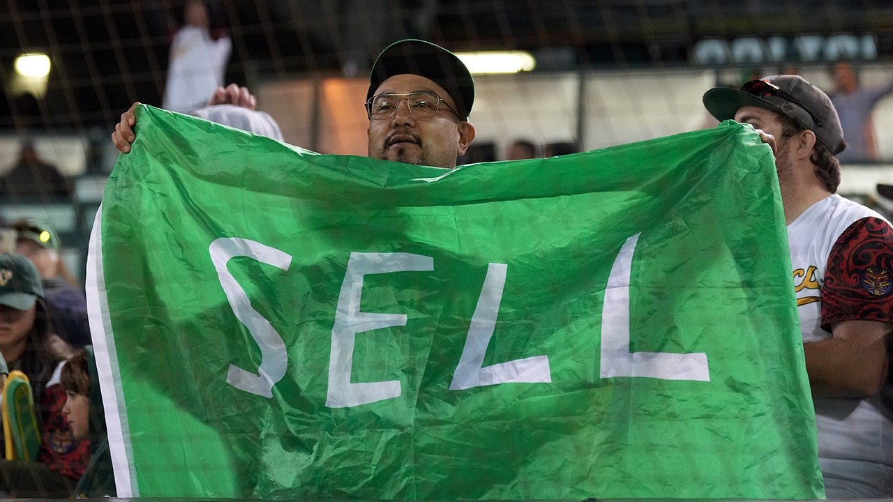 A's broadcast shows moment fan wearing 'SELL' shirt was confronted by security