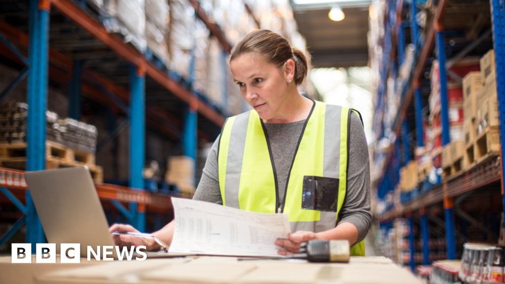 UK firms hold off on hiring as job vacancies fall
