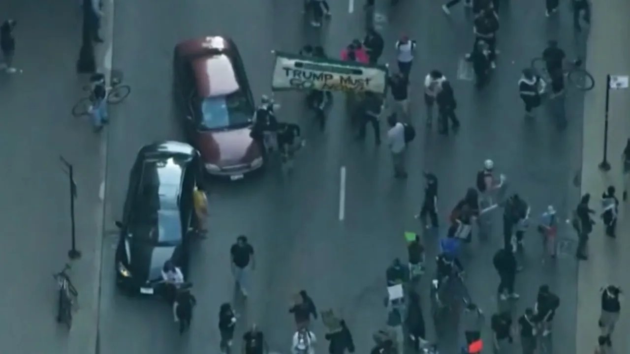 Car drives through anti-ICE protesters in Chicago as demonstrations grow