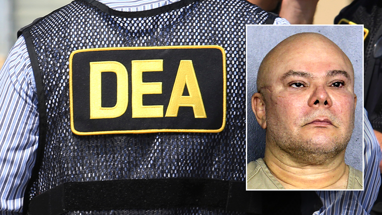 Ex-DEA informant on probation charged in cocaine trafficker extortion scheme