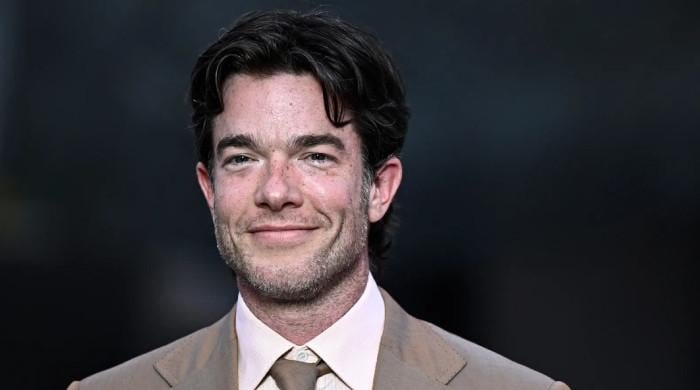 John Mulaney condemns violent messages to family after wife's comments