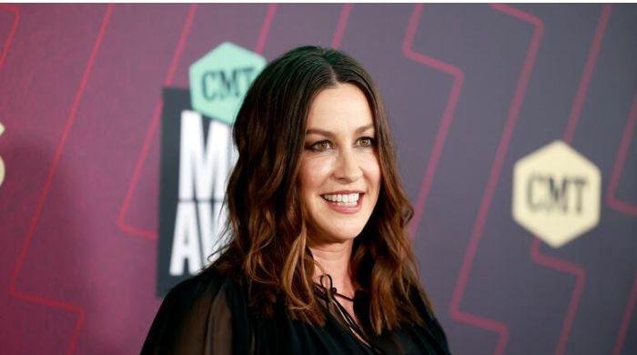 Alanis Morissette receives fashion help from Madonna at private event