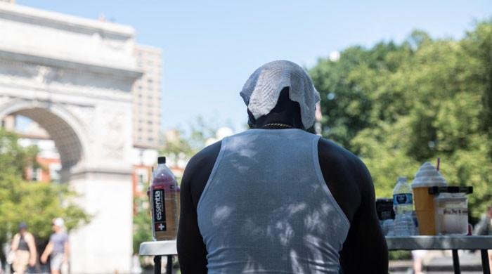 US cities endure record high temperatures on peak day of heat wave