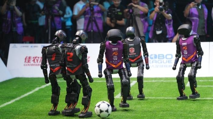 AI-powered autonomous robots face off in China football tournament