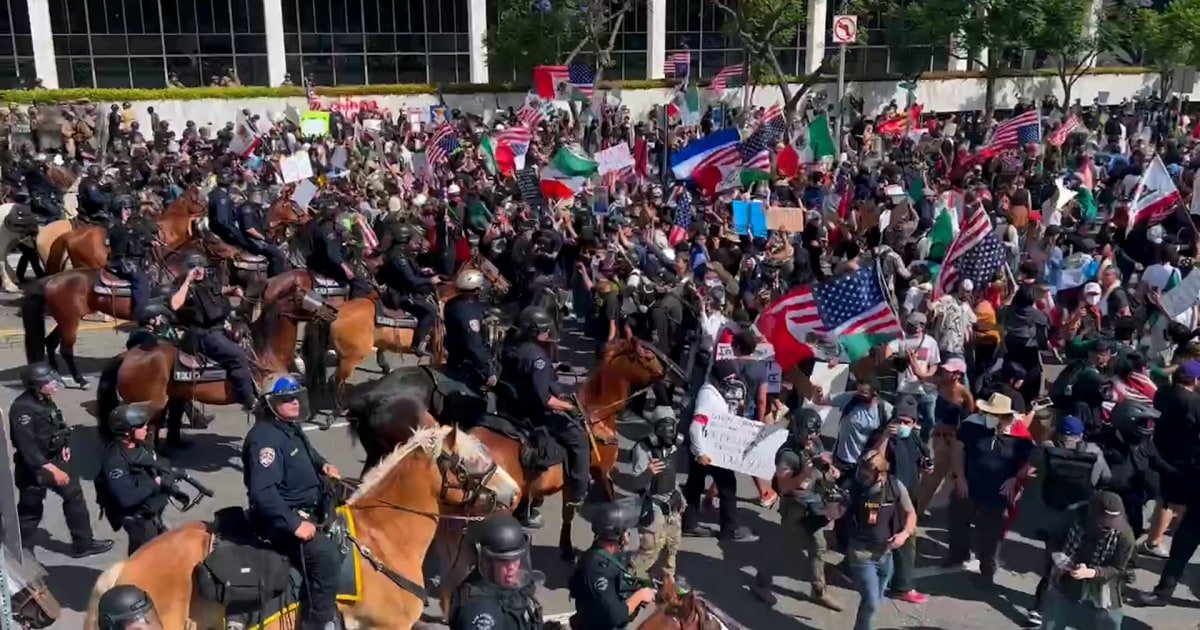 Officers on horseback push back crowds at L.A. ICE protest