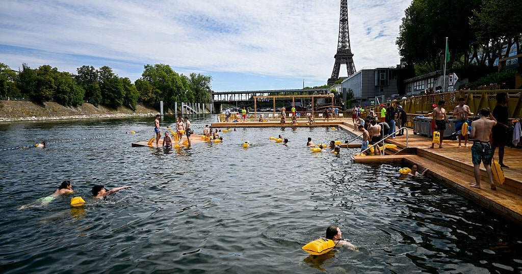 Parisians take a plunge in the Seine River after century-long ban