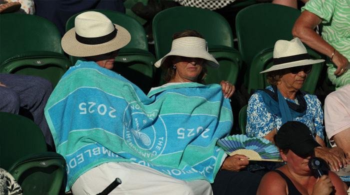Fans fry in stands as Wimbledon scorches to hottest-ever start at 32.3°C