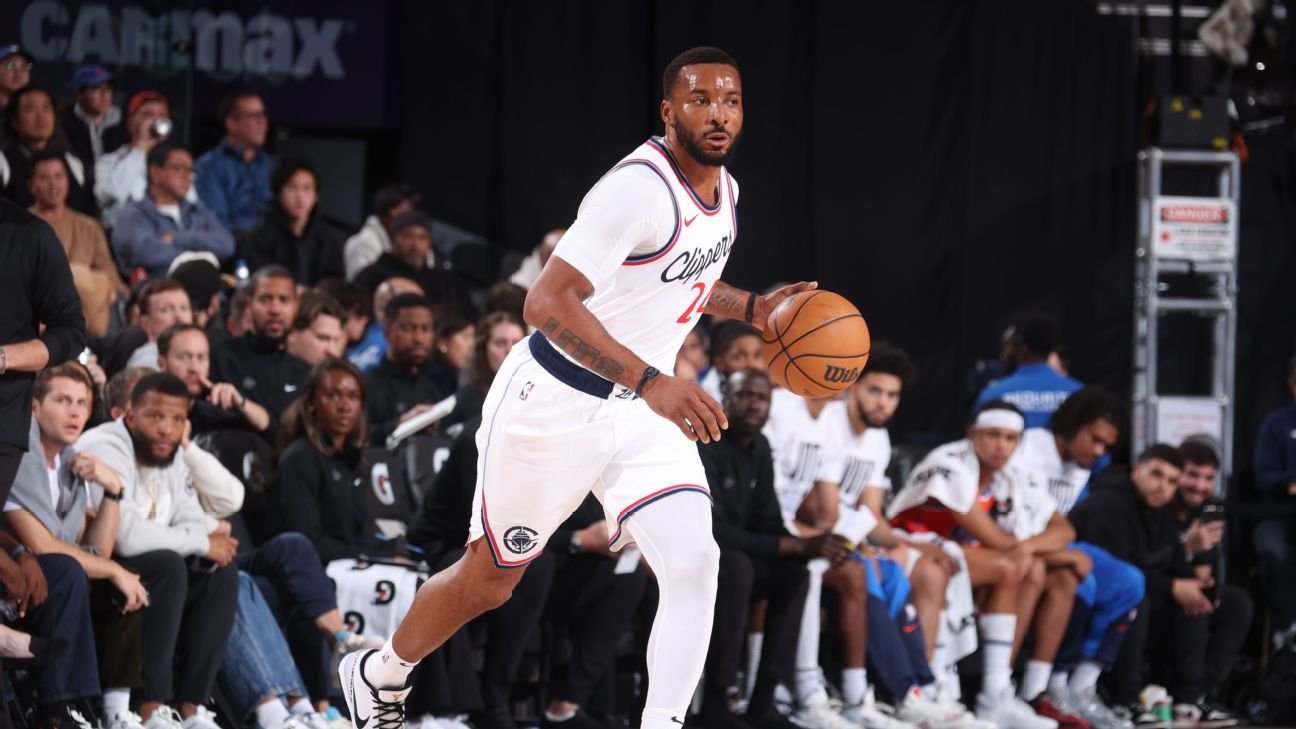 Sources - Powell to Heat, Collins to Clips in three-team trade